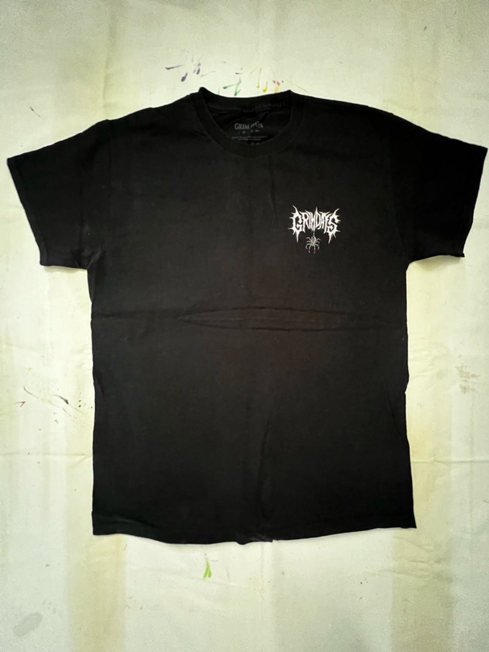 Black Short-Sleeve Tee with White Band Logo and Red-Accented Spider